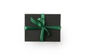 Top view of black present box with green ribbon isolated on white