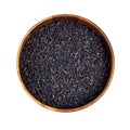 Top view of black sesame seeds in the round wooden bowl for cooking isolated on white background. Royalty Free Stock Photo