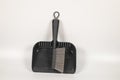 Top view of black small broom dustpan isolated a white background Royalty Free Stock Photo