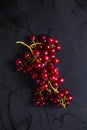 Top view of black table with red grape cluster