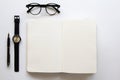 Top view. Black vintage glasses and open book and watch. Minimal Style on white background use for wallpaper and screen