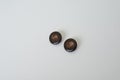 Top view of black vintage plastic buttons for sewing against a white background Royalty Free Stock Photo