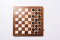 Top view of black and white checkers Royalty Free Stock Photo