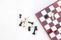 Top view Black and White chess pieces lie on chess board. Royalty Free Stock Photo