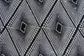 Top view of black and white fabric with geometric print and sequins Royalty Free Stock Photo