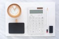 Top view of blackboard, pencil, eraser calculator and coffee cup