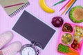 top view of blackboard and tray with kids lunch for school on trendy Royalty Free Stock Photo