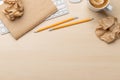 Top view of blank notepad, keyboard, coffee, apple and crumpled papers Royalty Free Stock Photo