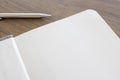 Top view of blank open notebook page and pencil on wood table Royalty Free Stock Photo