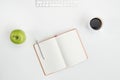 Top view of blank open notebook with pen cup of coffee green apple and keyboard Royalty Free Stock Photo