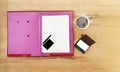 Top view blank paper note on file folder,cellphone,mobile phone, white cup of black coffee ,pen,empty business card on wooden tab Royalty Free Stock Photo