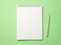 Top view blank paper Notebook and pencil. Desktop mock up, Flat lay of green working table background with office