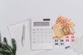 Top view, blank sheet with pen, calculator, euro banknotes and calendar number 31. Flat lay Royalty Free Stock Photo