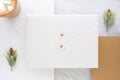 Top view of blank white envelop overlap on gold card with hot co