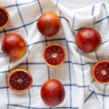 Top view, blood oranges on cloth. Flat lay, overhead, from above