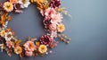 Top view of Blooming colorful wreath flowers and petals on background, Floral frame composition, copy space, flat lay