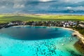 Top view of the Blue Bay lagoon of Mauritius. A boat floats on a turquoise lagoon Royalty Free Stock Photo