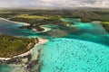 Top view of the Blue Bay lagoon of Mauritius. A boat floats on a turquoise lagoon Royalty Free Stock Photo