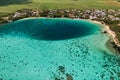 Top view of the Blue Bay lagoon of Mauritius. A boat floats on a turquoise lagoon Royalty Free Stock Photo