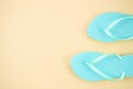 Top view blue beach flip flops isolated on a pastel beige background. Flat lay frame with copy space Royalty Free Stock Photo