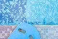 Blue floating pad near a swimming pool horizontal composition Royalty Free Stock Photo
