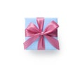 Top view of blue gift box with pink ribbon bow isolated on white background Royalty Free Stock Photo