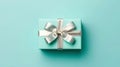 Top view on blue gift box with silver ribbon and bow. Royalty Free Stock Photo