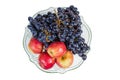 Top view of blue grapes and apples in fruits bowl Royalty Free Stock Photo