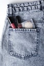 Top view of blue jeans and decorative cosmetic products in the back pocket.Concept of fashion lifystyle Royalty Free Stock Photo