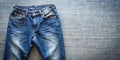 Top View of Blue Jeans on Plain Background Royalty Free Stock Photo