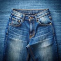 Top View of Blue Jeans on Plain Background Royalty Free Stock Photo