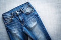 Top View of Blue Jeans on Plain Background Royalty Free Stock Photo