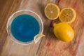 Top view blue margarita Cocktail drink, with lemon in the background, on rustic table Royalty Free Stock Photo