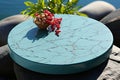 Top view blue podium for cosmetics and spa products with water texture and floating flowers