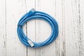 Top view blue usb cable on a white wood Royalty Free Stock Photo