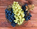 Top view of blue and white grapes in fruits bowl Royalty Free Stock Photo