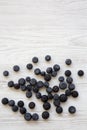 Top view, blueberries on a white wooden background. Copy space