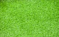 Top view of blurred artificial synthetic grass, blurred green background Royalty Free Stock Photo