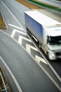 Top view of blurred truck driving on a highway. Presentation of speed in transport.