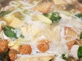 Top view of boiled fish ball and vegetavle in hot pot as a background