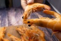 Top view of the boiled shrimp that are held in their hands leaning against each other they form the shape of a heart Royalty Free Stock Photo