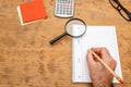 Top view book , calculator, glasses on wooden table Royalty Free Stock Photo