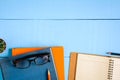 top view book mockup and pencil note on blue wood table