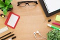 Top view. Book, paperclip, pencil, ruler, Highlighting pen, employee card, post it and tree pot on rustic brown wooden desk. Lifes Royalty Free Stock Photo