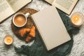 Top view of books,cup of coffee,croissants and candles. Selective focus Royalty Free Stock Photo
