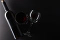 Top view of bottle and glasses with red wine on black background. Space for text. Horizontal format. Template concept for your Royalty Free Stock Photo
