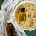 Top view of bottles with sesame seed essential oil