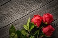 Top view bouquet of beautiful roses on a wooden background with copy space: concept romantic background Royalty Free Stock Photo