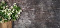 Top view of bouquet of jasmine in on wooden table. Valentine`s day greeting card Copy space Top view