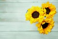 Top view of a bouquet of three yellow sunflowers in a glass vase Royalty Free Stock Photo